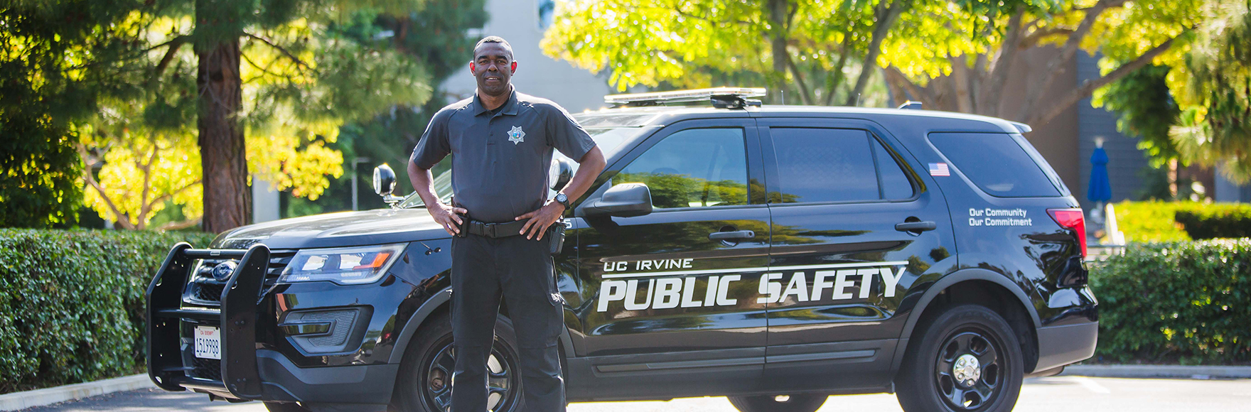 Public Safety Responder smiling in front of car