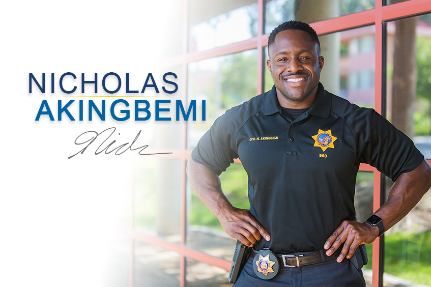 Profile photo of Officer Nicholas Akingbemi smiling for the camera